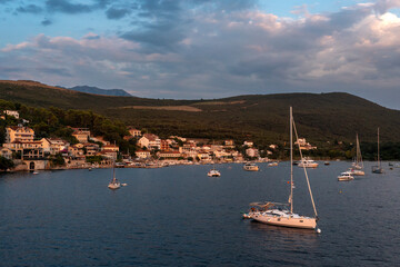Aerial view of little fisher village bay with yachts and catamarans