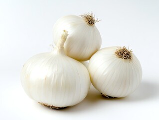 Fototapeta premium Three White Onions Stacked Together on a Clean Background for Cooking