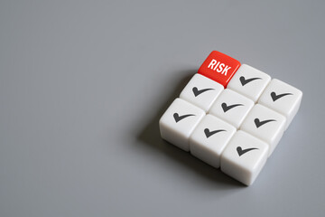 close up at the red cube to identify red danger risk cube among other normal incident. Risk management concept for business and personal planning for risk mitigation..