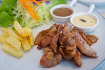 Gourmet experience delicious grilled chicken with fresh salad in a restaurant setting