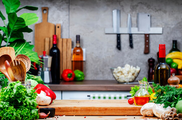Food background. Healthy eating, cooking, blogging scene. Оak cutting board with paprika, mushrooms, lettuce and knife on cozy kitchen with wooden table, kitchenware and utensils