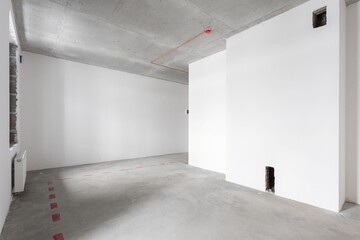 interior of the apartment without decoration in gray colors. rough finish