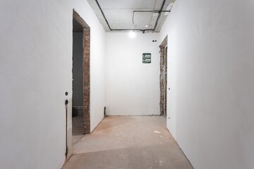 interior of the apartment without decoration in gray colors. rough finish