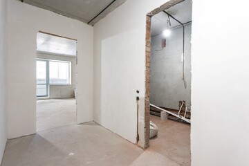 interior of the apartment without decoration in gray colors. rough finish
