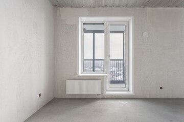interior of the apartment without decoration in gray colors. rough finish