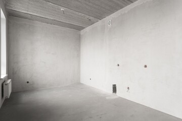interior of the apartment without decoration in gray colors. rough finish