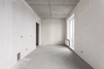 interior of the apartment without decoration in gray colors. rough finish