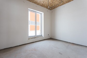 interior of the apartment without decoration in gray colors. rough finish