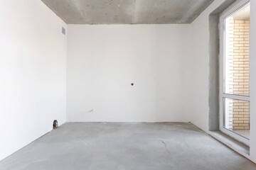 interior of the apartment without decoration in gray colors. rough finish