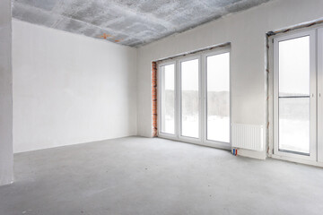 interior of the apartment without decoration in gray colors. rough finish