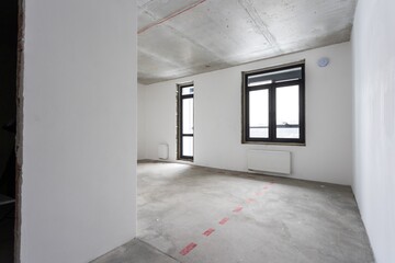interior of the apartment without decoration in gray colors. rough finish