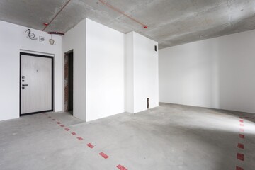 interior of the apartment without decoration in gray colors. rough finish