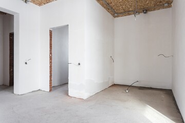interior of the apartment without decoration in gray colors. rough finish