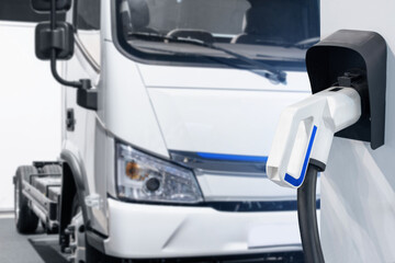 Electric vehicles charging station on a background of a truck