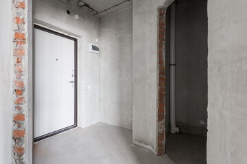 interior of the apartment without decoration in gray colors. rough finish