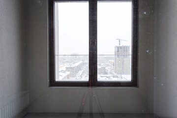 interior of the apartment without decoration in gray colors. rough finish