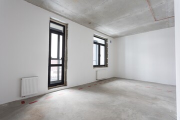 interior of the apartment without decoration in gray colors. rough finish