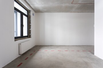 interior of the apartment without decoration in gray colors. rough finish