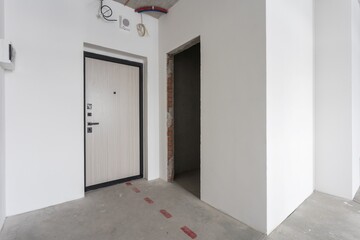 interior of the apartment without decoration in gray colors. rough finish
