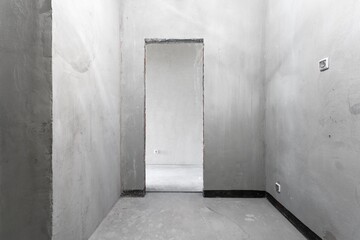 interior of the apartment without decoration in gray colors. rough finish