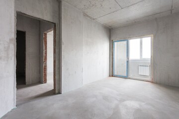 interior of the apartment without decoration in gray colors. rough finish