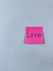 Sticky note with Love written on it, set on a white background. Image symbolizes love, care, and closeness, ideal for personal and romantic themes. Perfect for concept illustrations