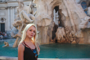 Obraz premium A Stylish Woman Taking Time to Relax in a Beautiful Historic Roman Landscape Setting