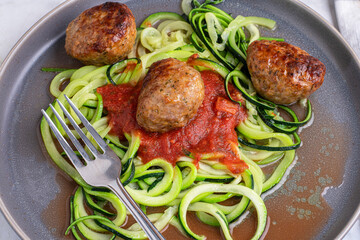 zucchini noodles with pasta sauce and meat balls