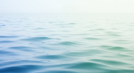 Calm ocean water with subtle color variations stretching to the horizon