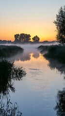 Fototapeta premium Serene sunrise over tranquil river reflecting misty trees peaceful dawn landscape idyllic nature scene