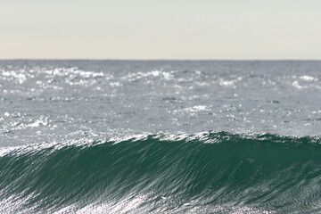 Ocean wave forming at adraga beach, sintra, portugal