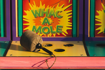 Classic Whac a Mole game sits unused at a carnival.