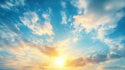 Fototapeta premium Radiant sky panorama at dawn with soft clouds and golden sunlight creating a serene and hopeful atmosphere in a beautiful day