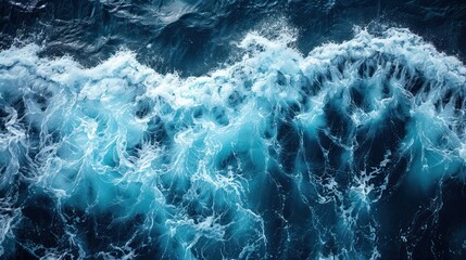 Ocean waves crashing, top view of turbulent sea, dark blue water, white foam