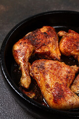baked chicken legs, with crispy skin, served in a pan, rustic style, homemade, no people,