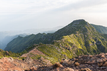 Pico Ruivo hiking path under soft sunlight, dramatic mountain scenery in Madeira Portugal