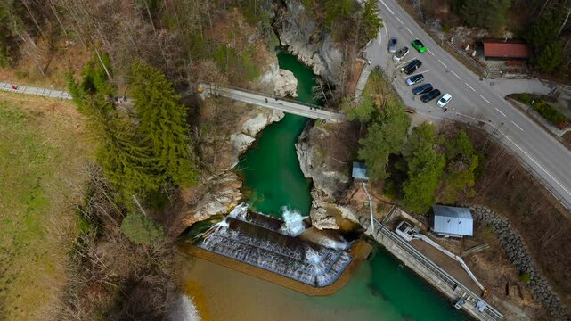 Aerial view of gorges, trail, viewing platform and waterfall on Lech River in Fussen, Germany. Landmark located on border with Austria. Lechfall Stauwehr am Lech Luftaufnahme, Fuessen, Deutschland. 