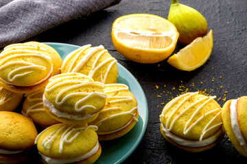 Homemade round lemon cookies. French sweet yellow cookies macarons.