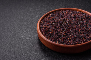 Red or brown raw rice in a ceramic bowl