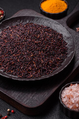 Red or brown raw rice in a ceramic bowl