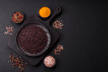 Red or brown raw rice in a ceramic bowl