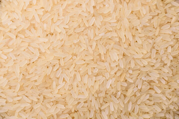 White raw rice in a ceramic bowl. Rice as an ingredient