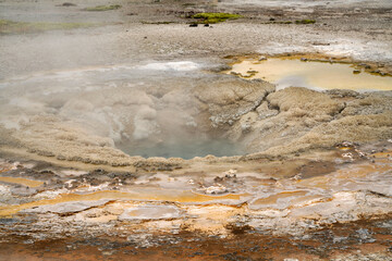 Steaming and bubbling geyser in Yellowstone National Park Wyoming