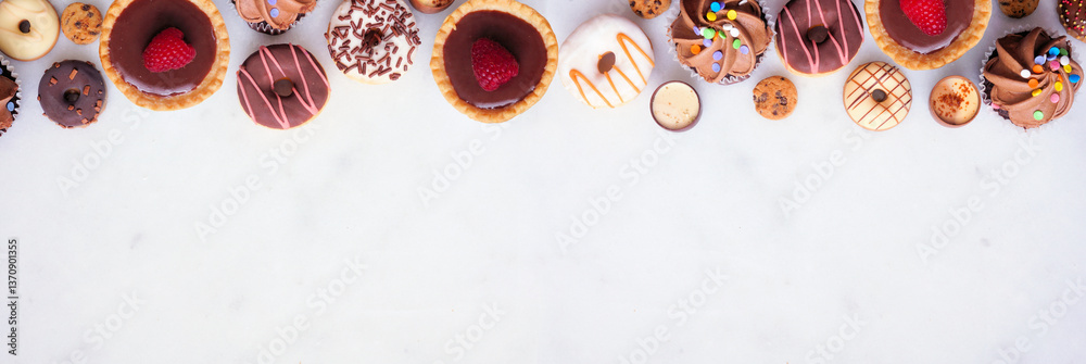 Poster dessert top border with a variety of sweets. top view on a white stone banner background with copy s