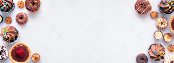 Dessert double border with a variety of sweets. Top view on a white stone banner background with copy space. © Jenifoto