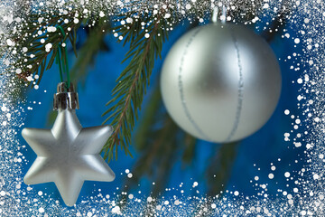 Christmas composition of fir branches and Christmas balls of viburnum on a concrete background....