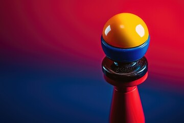 A multi-colored game piece with yellow, blue, black and red tones is displayed against a vibrant, reflective gradient background.