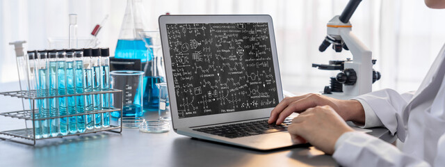 Mathematic equations and brisk formula on computer screen showing concept of science and education