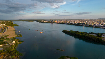 São Francisco river during sunset with boat crossing