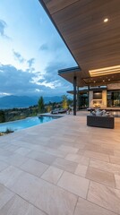 Modern patio, pool, mountain view, evening light.